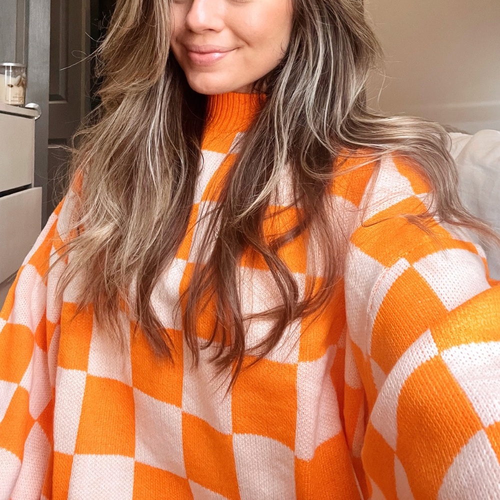 Orange checkerboard a sweater
